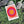 Ring of Trouble minimalist Danish art poster with soft red, purple and yellow gradients on enhanced matte paper. Poster placed in nature.
