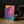 Wistful Light minimalist Danish art poster with soft red, purple and yellow gradients on enhanced matte paper. Interior setting.